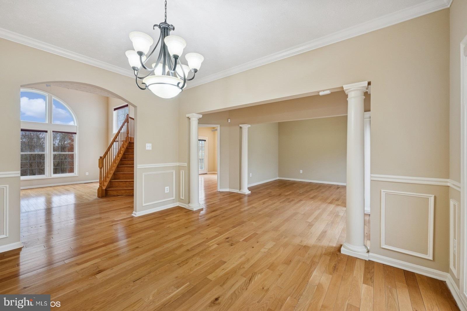 6965 Hawkins Gate Road La Plata, MD 20646 - Photo 8 of 55 a view of empty room with wooden floor and fan