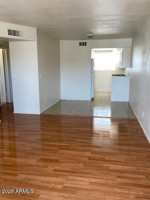 1809 N Spring, Unit 202 Mesa, AZ 85203 - Photo 2 of 4 a view of empty room with wooden floor