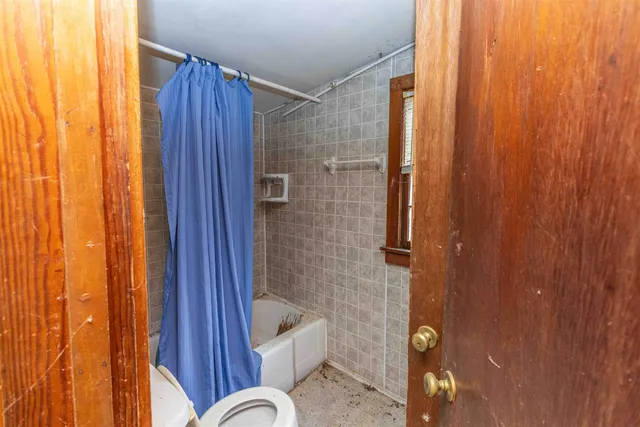 a bathroom with a shower curtain