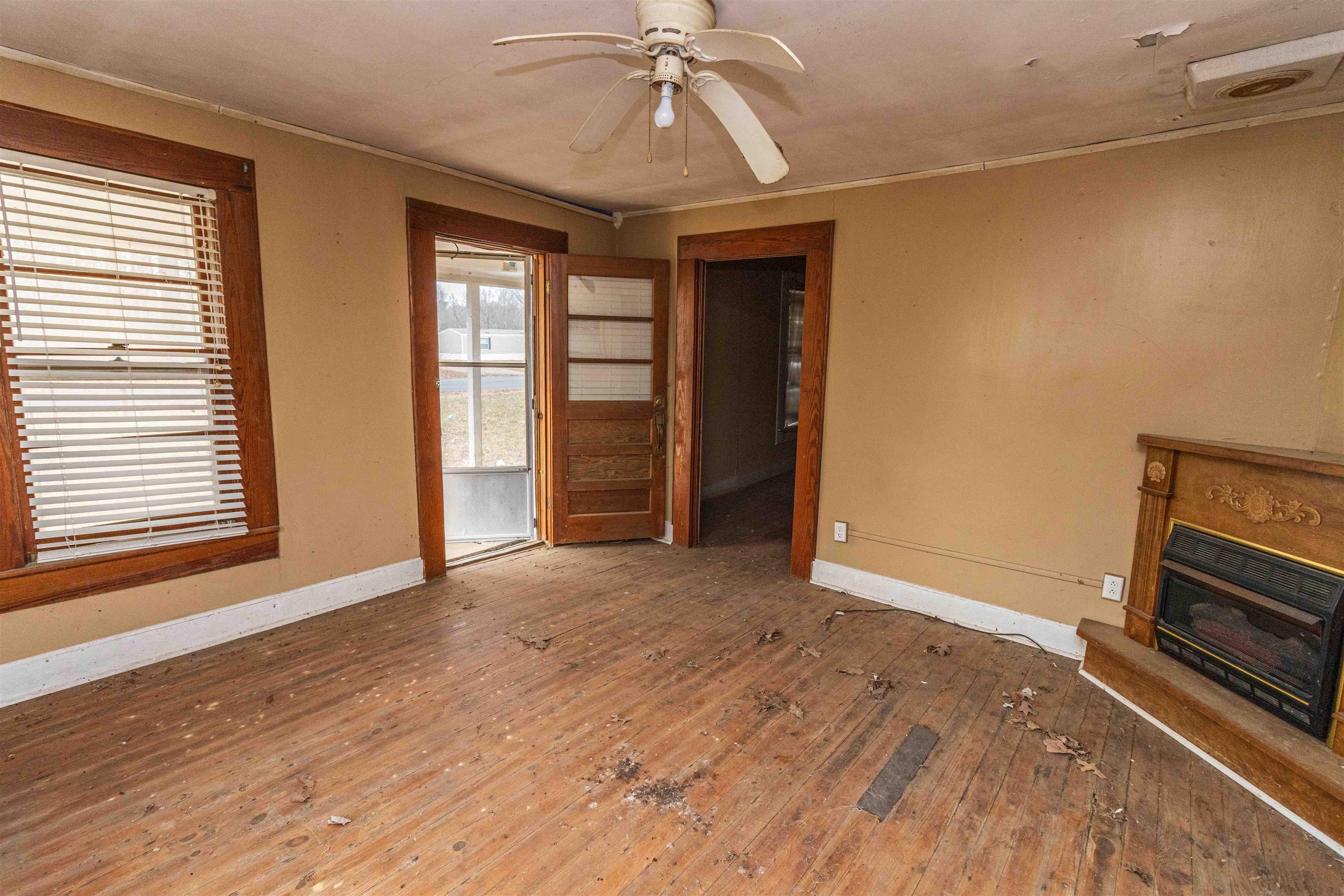 4850 Pleasant Site Road Selmer, TN 38375 - Photo 6 of 18 a view of livingroom with hardwood floor and window
