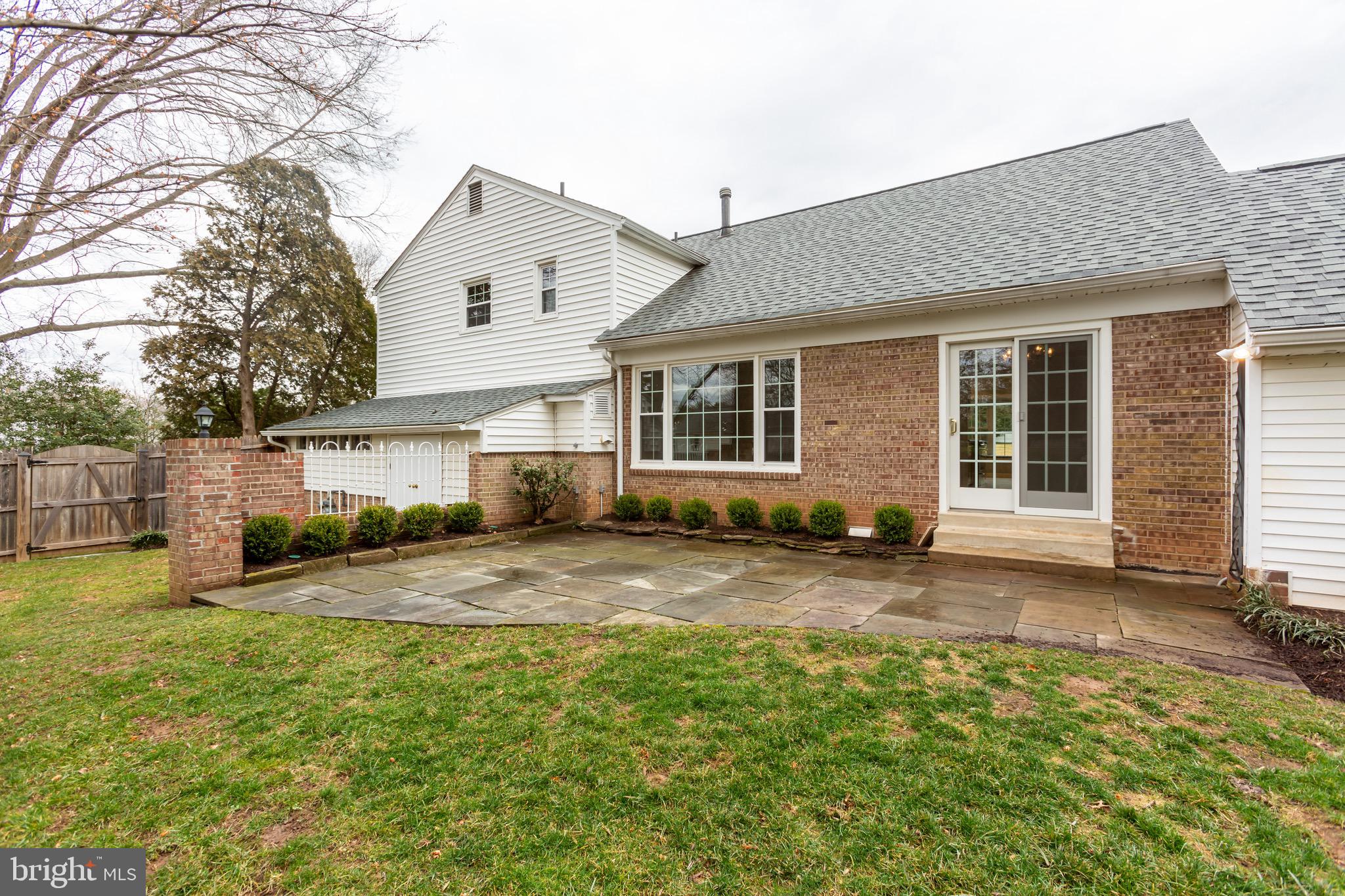 13316 Old Forge Road Silver Spring, MD 20904 - Photo 42 of 47 The flagstone patio and brick privacy wall