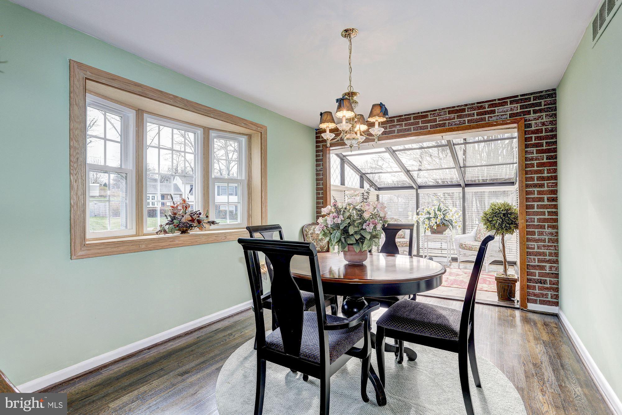 216 Radstock Road Baltimore, MD 21228 - Photo 7 of 29 Formal Dining Room flows into Sunroom