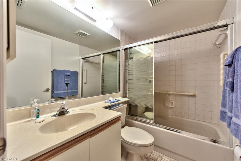 14730 Eagle Ridge Drive, Unit 122 Fort Myers, FL 33912 - Photo 17 of 27 a bathroom with a sink toilet and shower