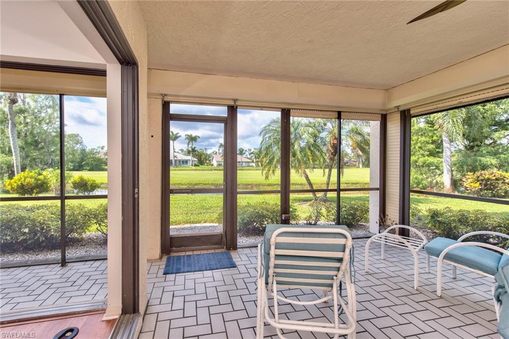 14730 Eagle Ridge Drive, Unit 122 Fort Myers, FL 33912 - Photo 21 of 27 a room with large windows and a table