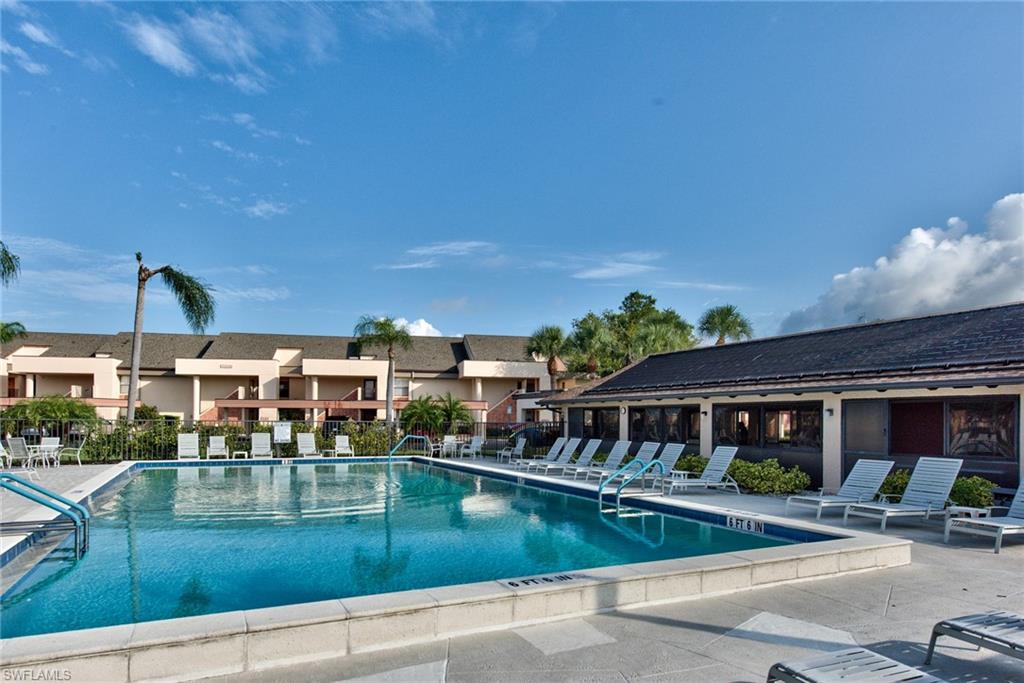 14730 Eagle Ridge Drive, Unit 122 Fort Myers, FL 33912 - Photo 24 of 27 front view of a house with a swimming pool