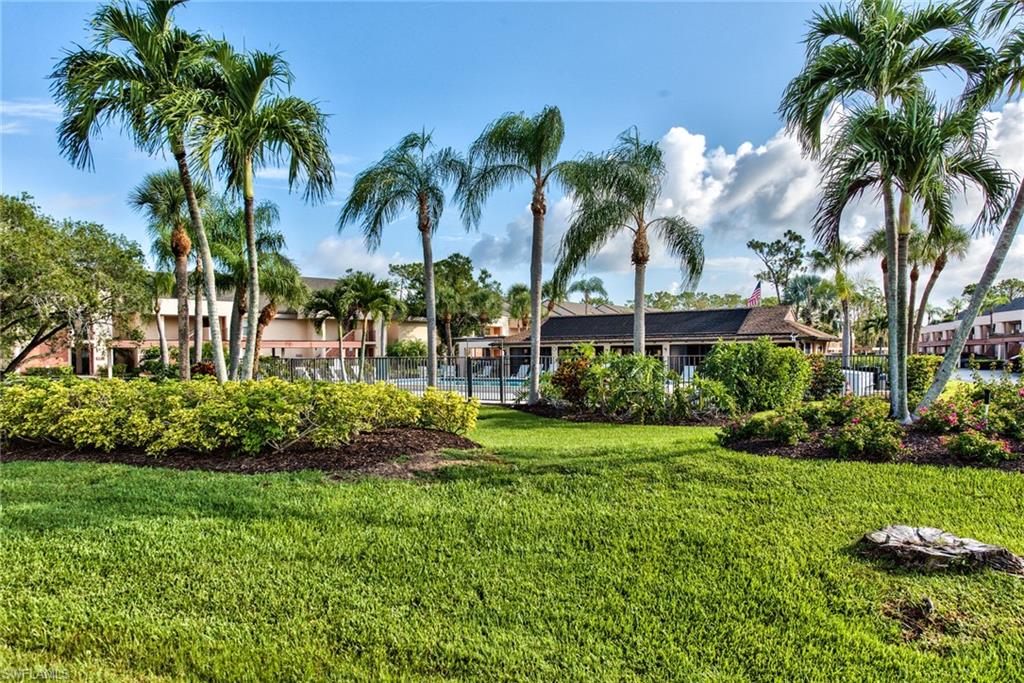 14730 Eagle Ridge Drive, Unit 122 Fort Myers, FL 33912 - Photo 26 of 27 a front view of a house with a garden