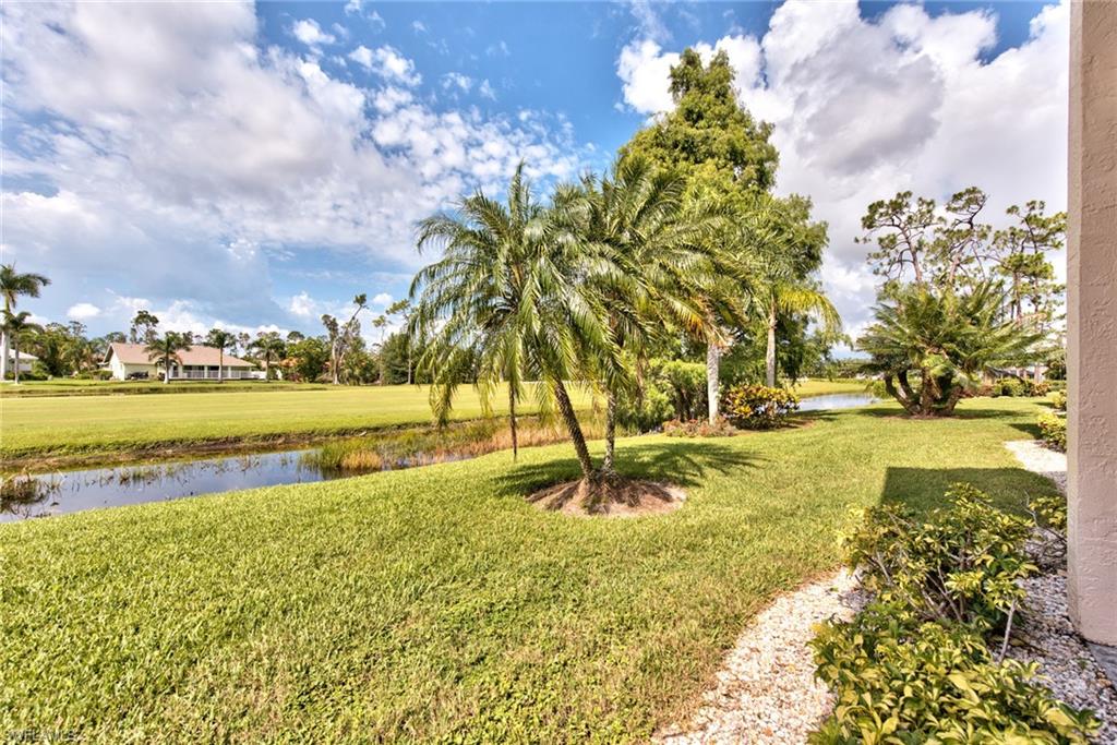 14730 Eagle Ridge Drive, Unit 122 Fort Myers, FL 33912 - Photo 7 of 27 a view of a lake with a big yard