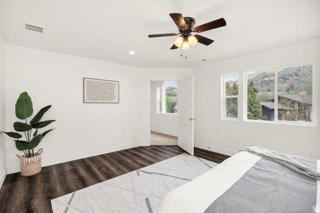1552 Sumac Drive Logan, UT 84321 - Photo 28 of 72 Spacious room featuring dark wood-finish flooring, a ceiling fan with integrated lighting, recessed lighting, and white trim