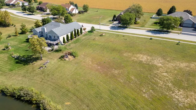 an aerial view of residential houses with outdoor space