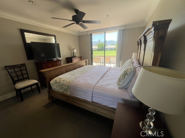 36 El Toro Drive Rancho Mirage, CA 92270 - Photo 21 of 25 a bedroom with a bed a couch and a flat screen tv