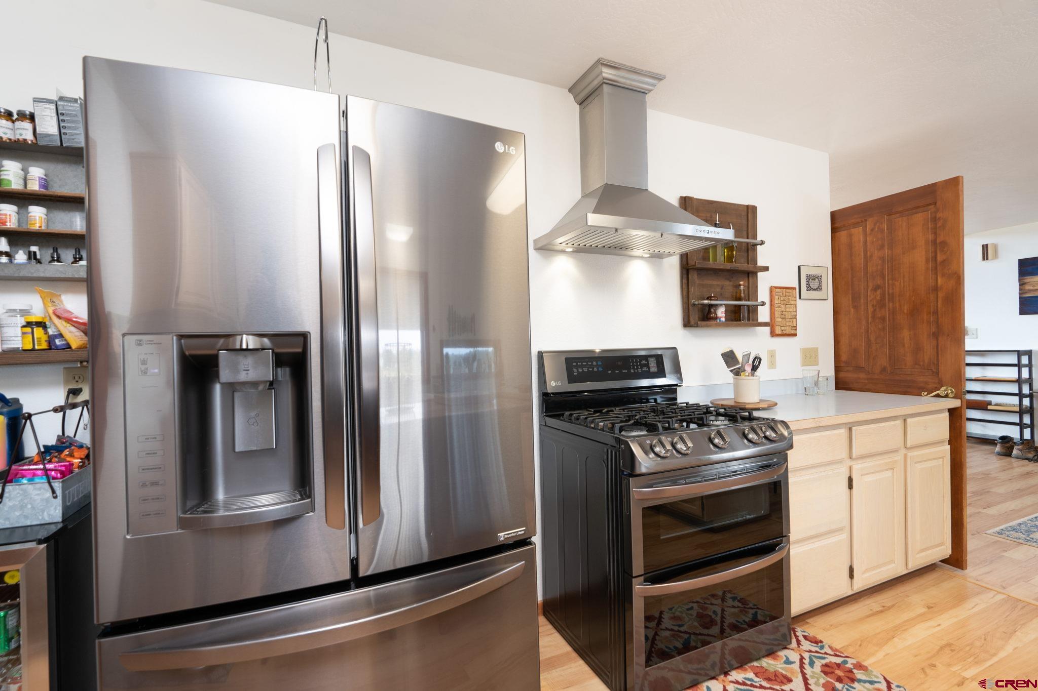 12190 Road 16 Cortez, CO 81321 - Photo 12 of 31 a kitchen with stainless steel appliances a refrigerator and a stove