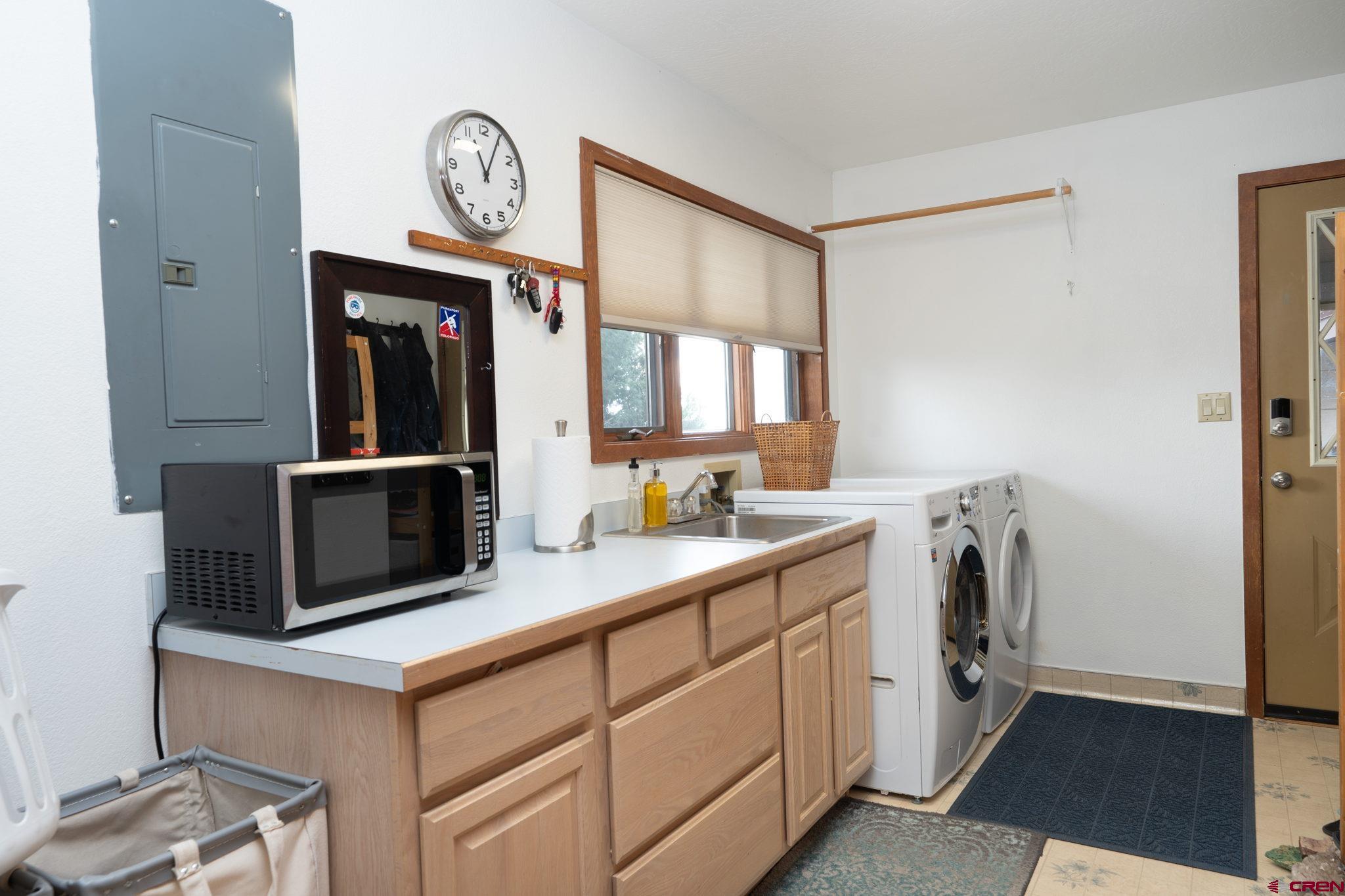 12190 Road 16 Cortez, CO 81321 - Photo 14 of 31 a utility room with dryer and washer