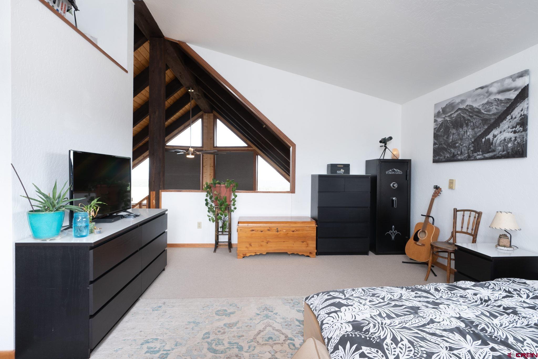 12190 Road 16 Cortez, CO 81321 - Photo 16 of 31 a living room with furniture and a flat screen tv