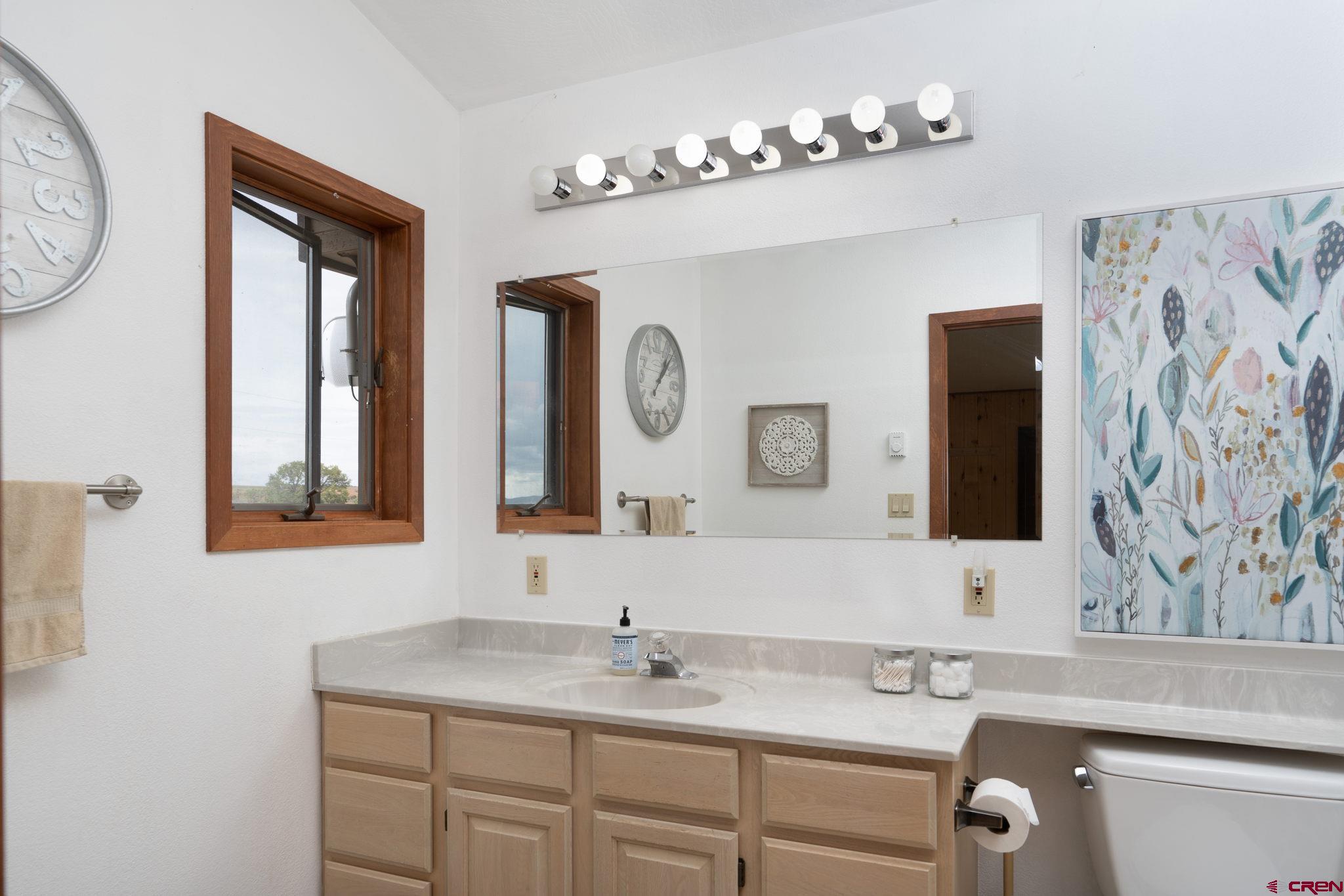 12190 Road 16 Cortez, CO 81321 - Photo 20 of 31 a bathroom with a sink and a mirror
