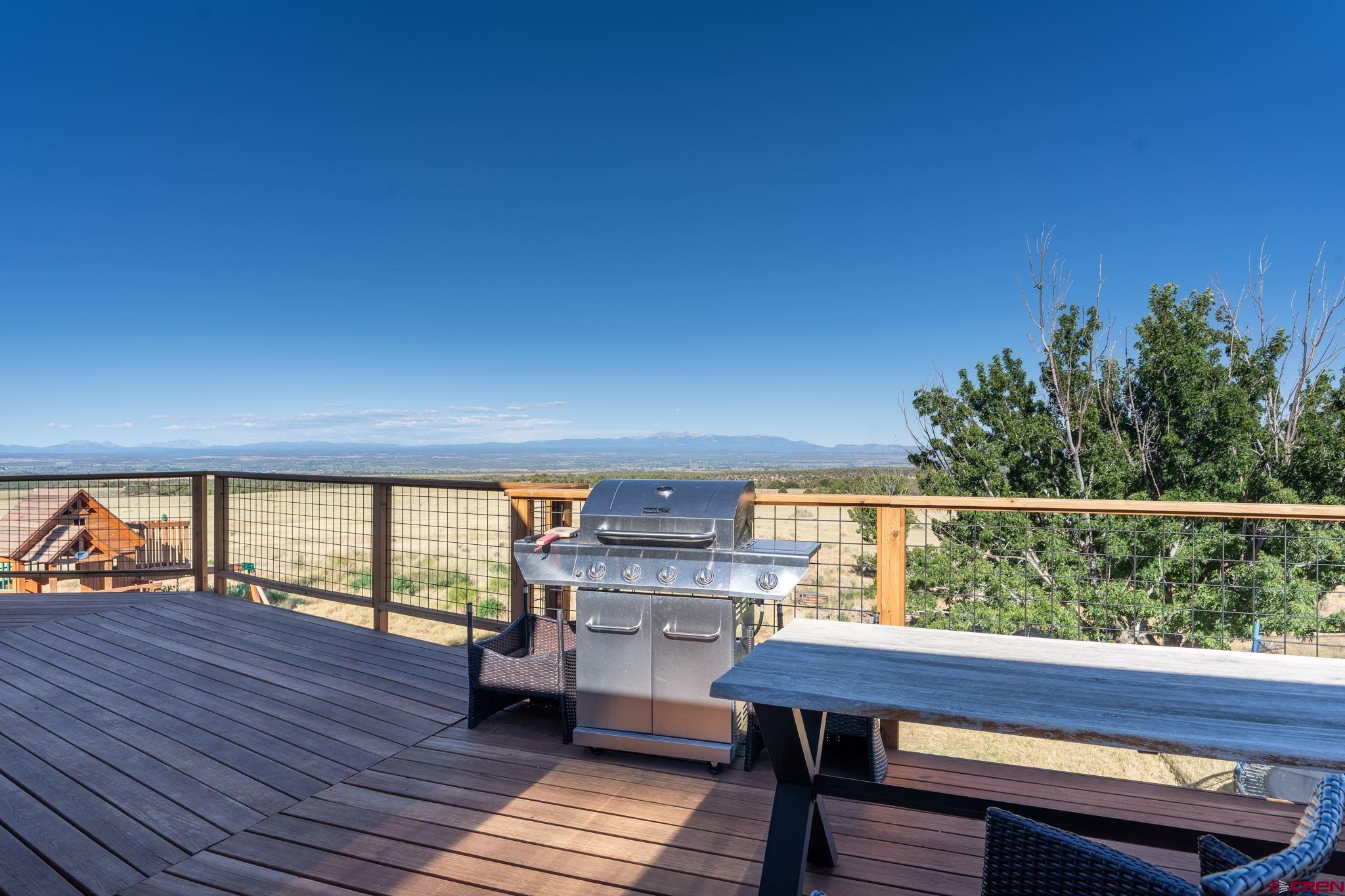 12190 Road 16 Cortez, CO 81321 - Photo 26 of 31 a view of roof deck with seating space and wooden floor