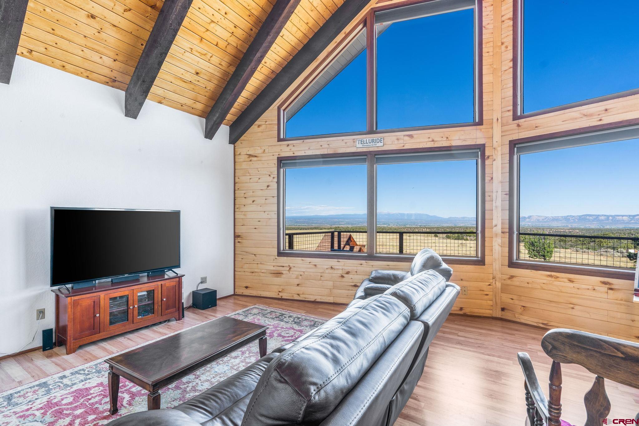 12190 Road 16 Cortez, CO 81321 - Photo 6 of 31 a living room with furniture and a flat screen tv