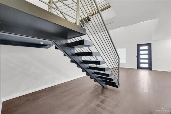 a view of a hallway with stairs