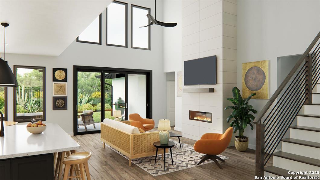 105 Tortuga Boerne, TX 78006 - Photo 5 of 7 a living room with furniture a flat screen tv and large windows