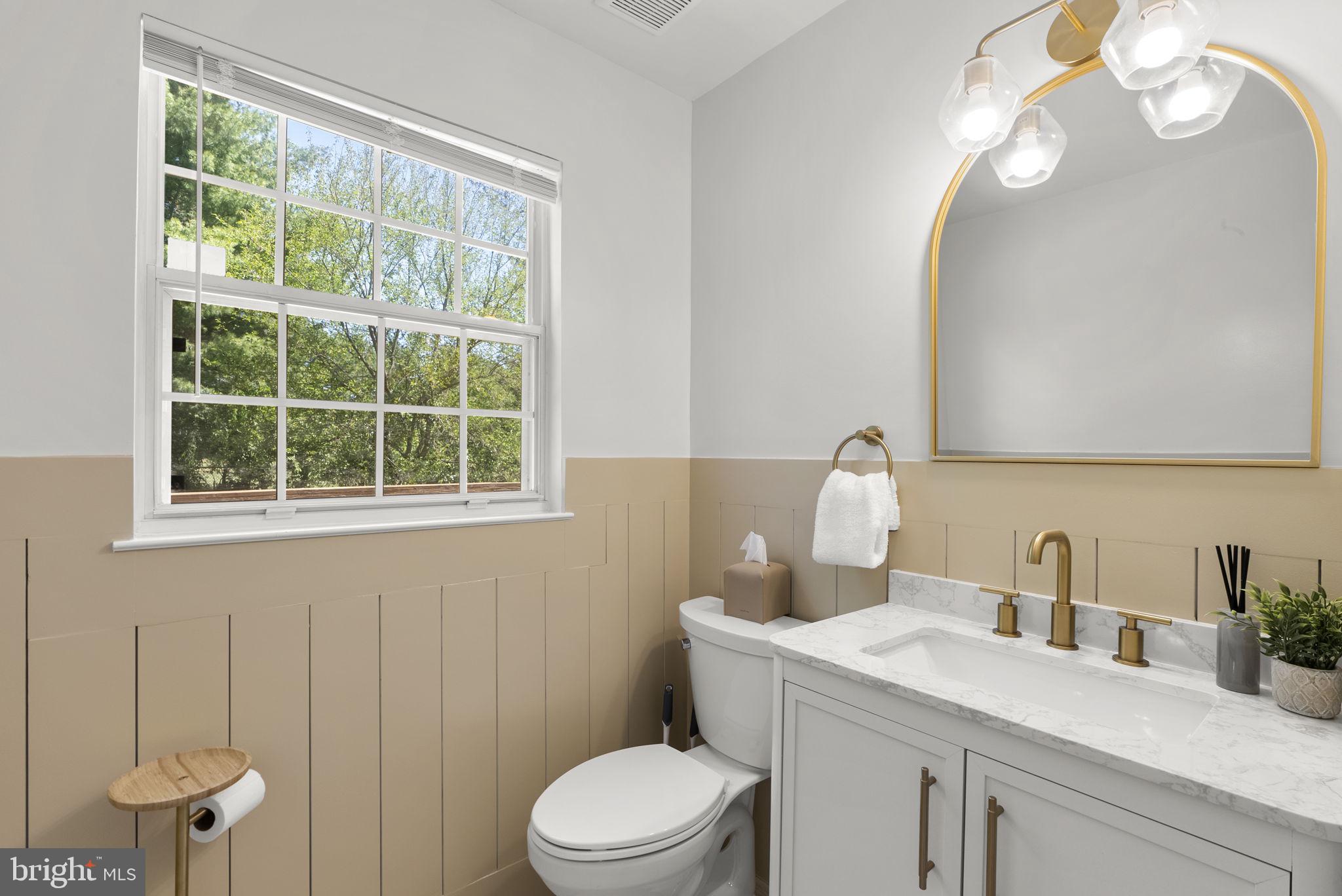 15809 Chagall Terrace North Potomac, MD 20878 - Photo 13 of 37 a bathroom with a sink a toilet and a window