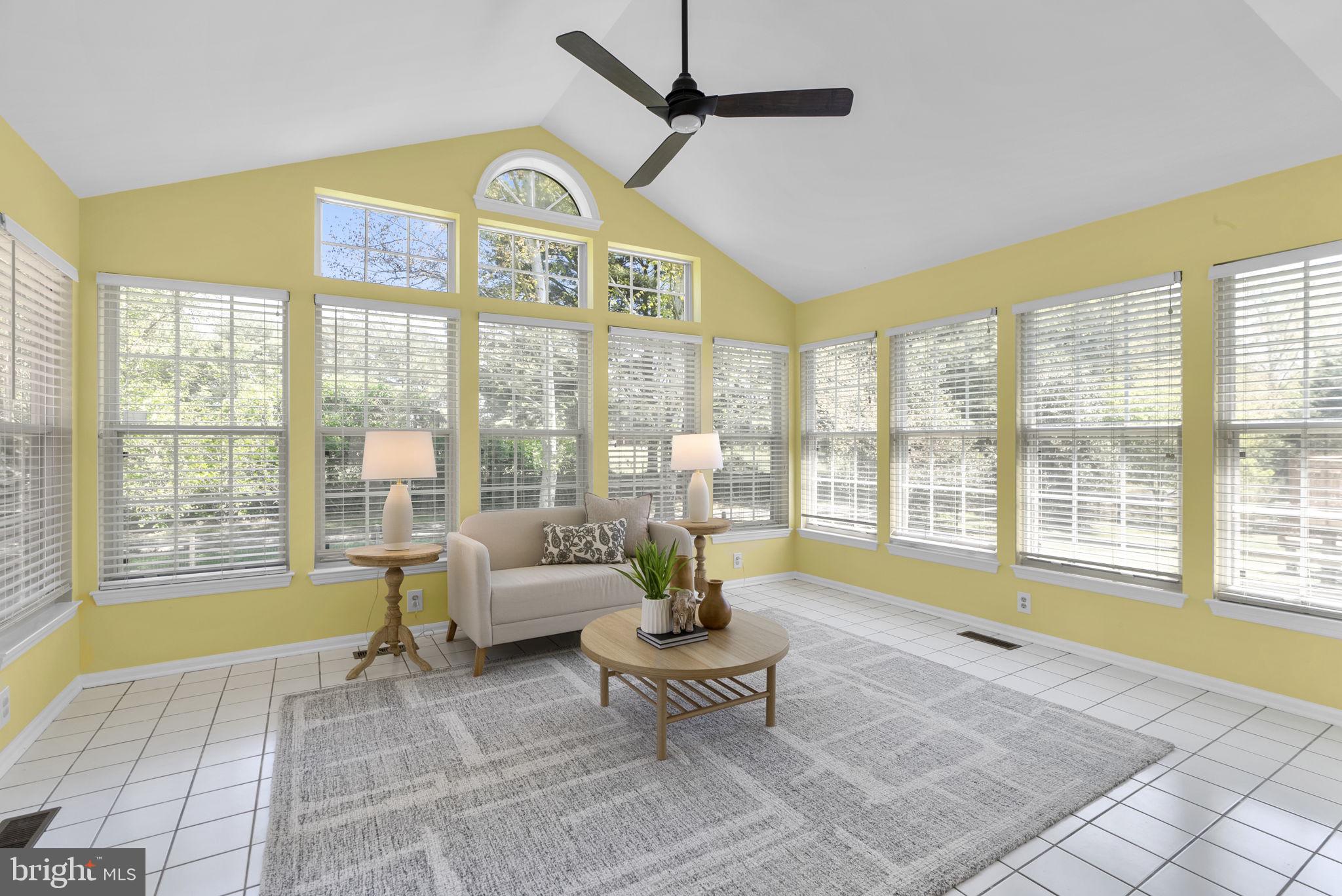 15809 Chagall Terrace North Potomac, MD 20878 - Photo 16 of 37 a living room with furniture and a floor to ceiling window