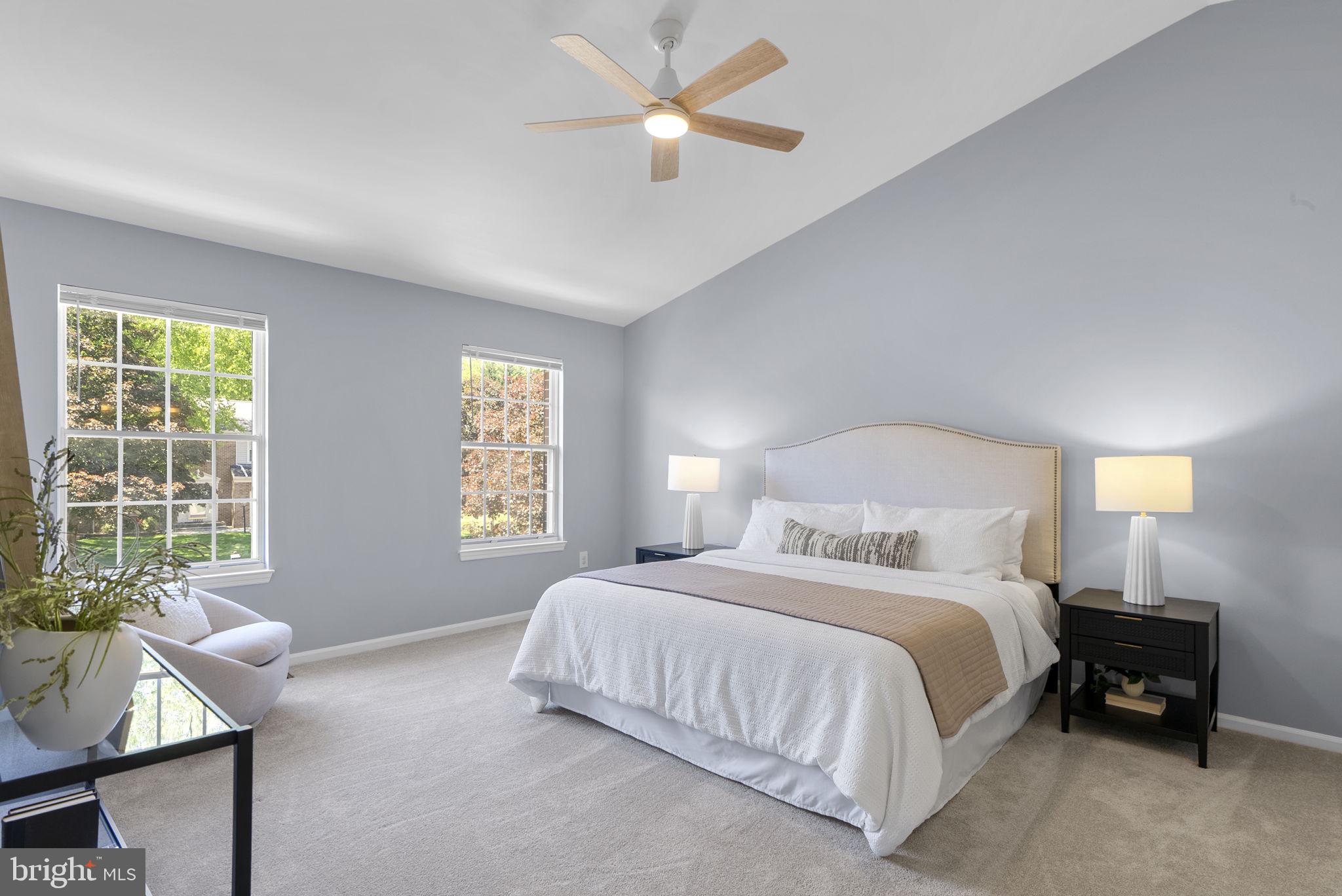 15809 Chagall Terrace North Potomac, MD 20878 - Photo 18 of 37 a bedroom with a bed and a chandelier