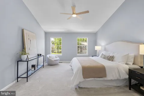 a bedroom with a bed and a couch