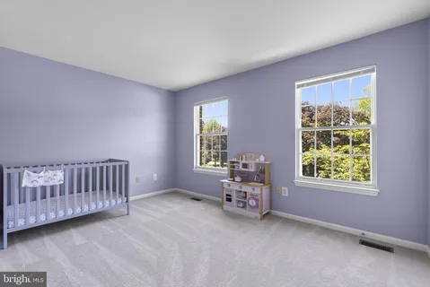 a view of an empty room with windows