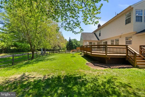 a view of an house with backyard space and garden