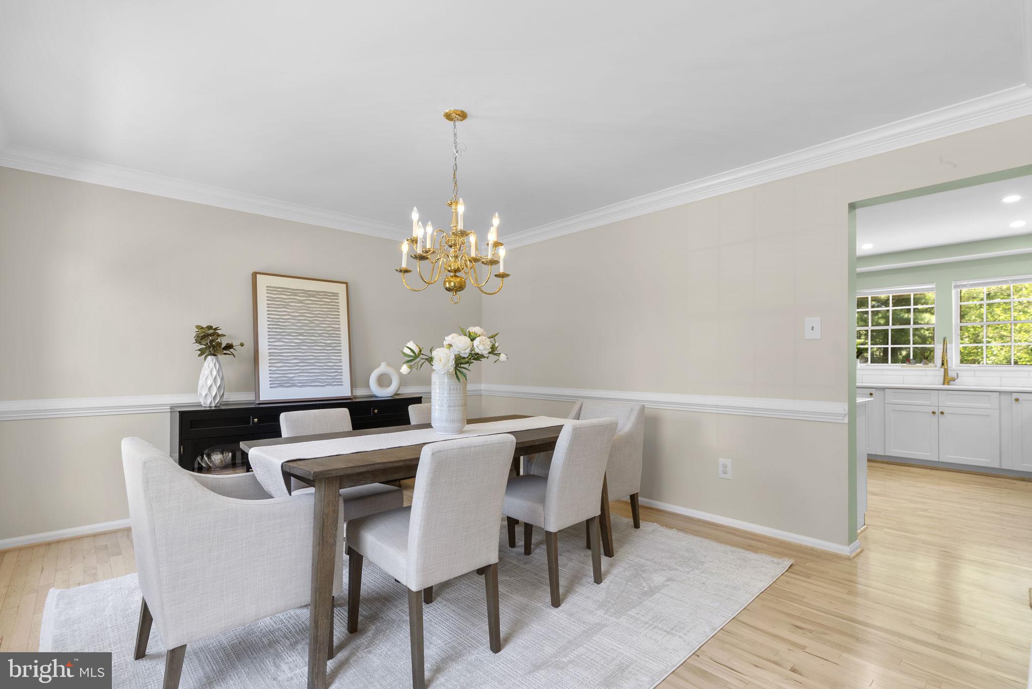 15809 Chagall Terrace North Potomac, MD 20878 - Photo 5 of 37 a view of a dining room with furniture and wooden floor