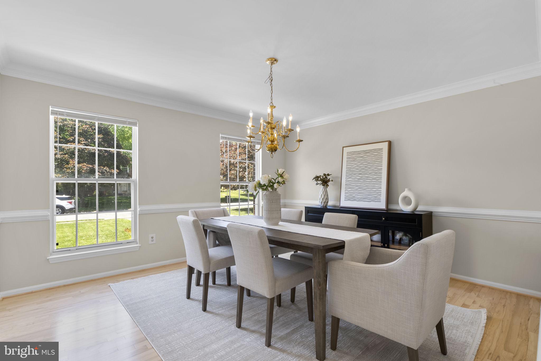 15809 Chagall Terrace North Potomac, MD 20878 - Photo 6 of 37 a view of a dining room with furniture and a chandelier