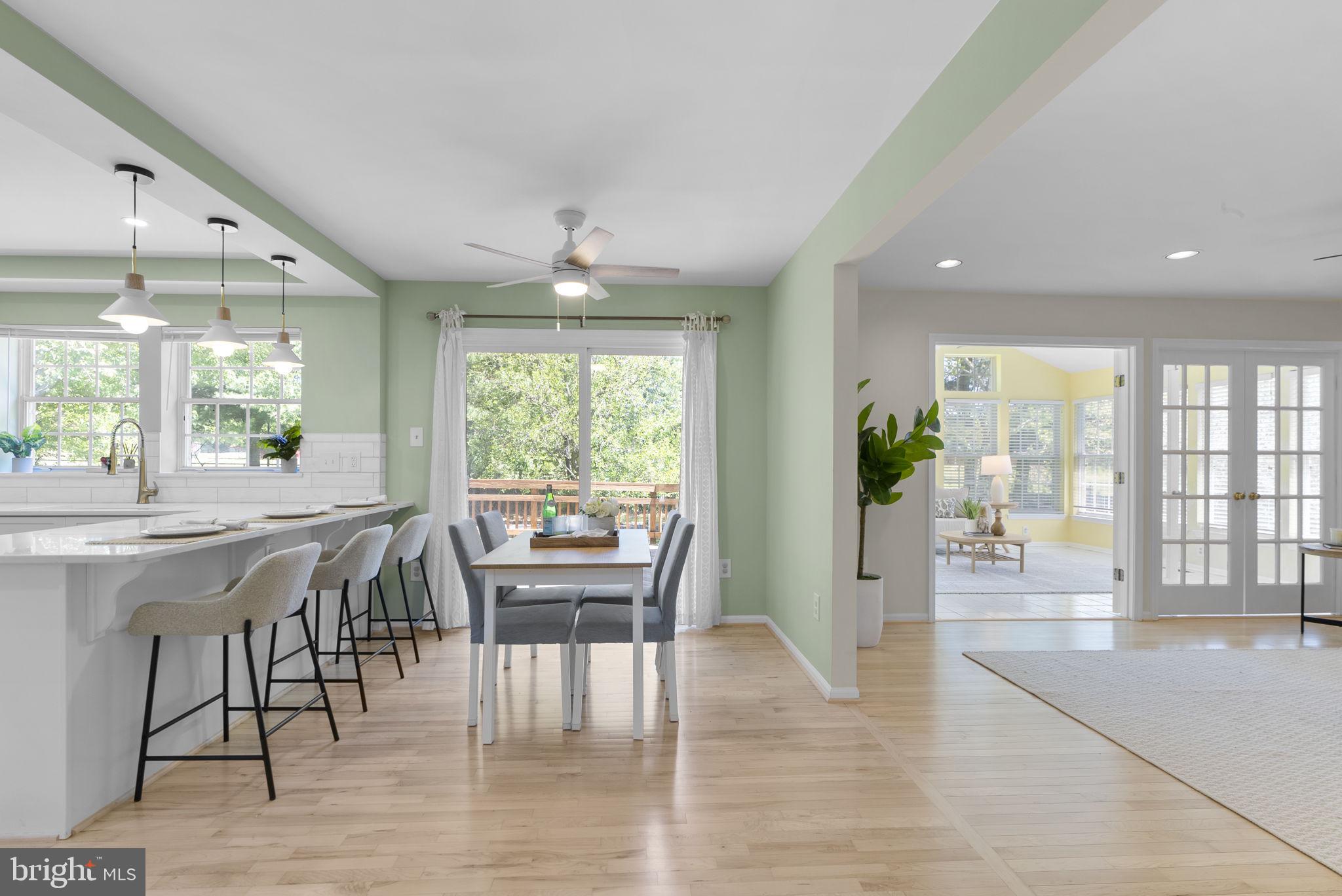15809 Chagall Terrace North Potomac, MD 20878 - Photo 7 of 37 a view of a dining room with furniture and wooden floor