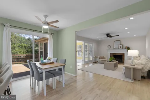 a view of a dining room with furniture wooden floor and chandelier