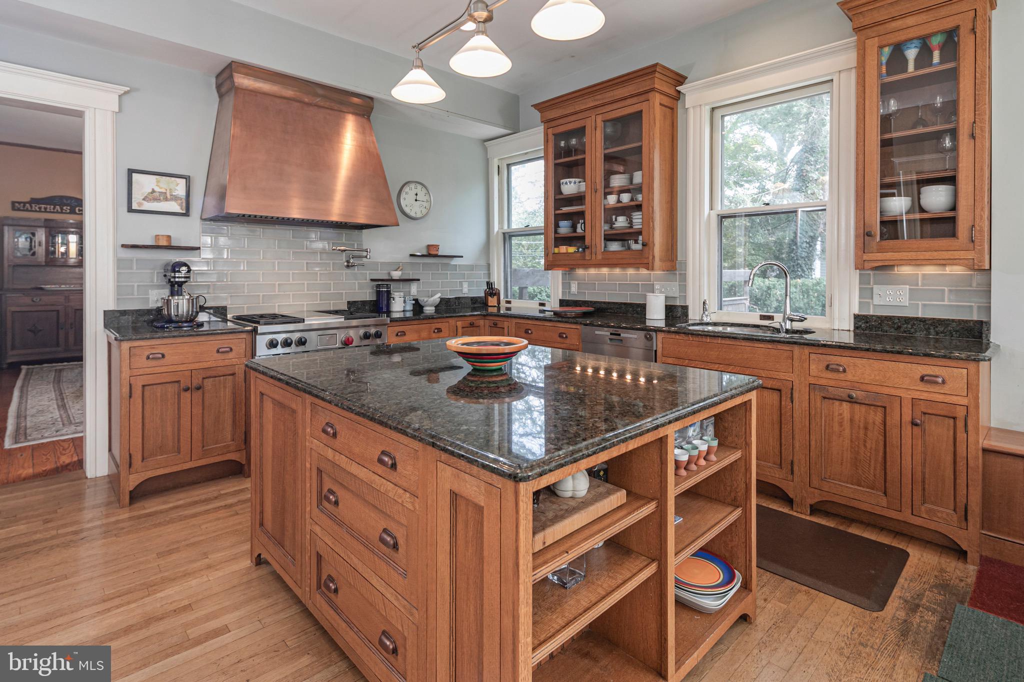 54 Hodge Road Princeton, NJ 08540 - Photo 15 of 51 a kitchen with stainless steel appliances granite countertop a stove a sink and a microwave