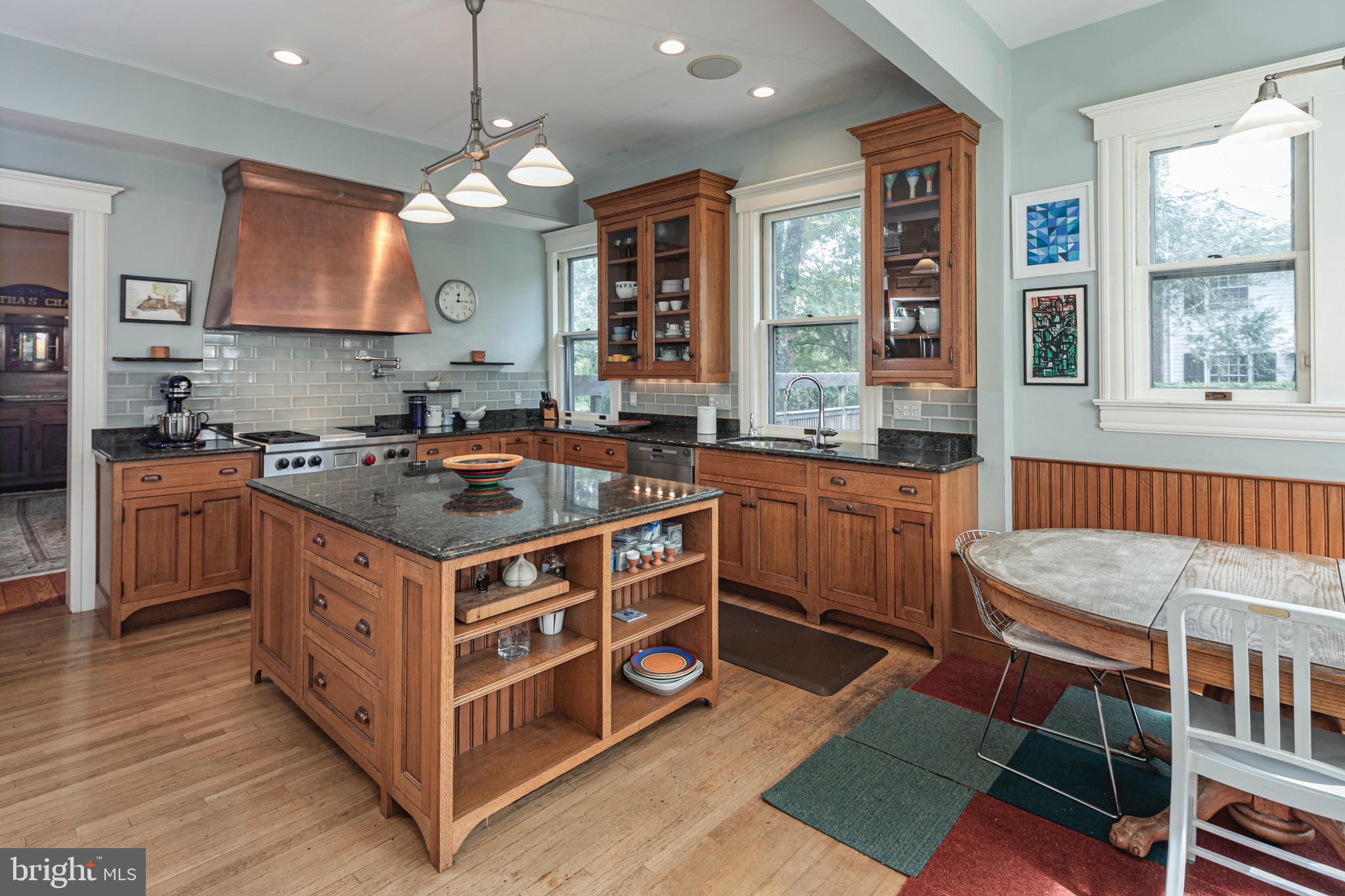 54 Hodge Road Princeton, NJ 08540 - Photo 16 of 51 a kitchen that has a lot of cabinets in it and wooden floor