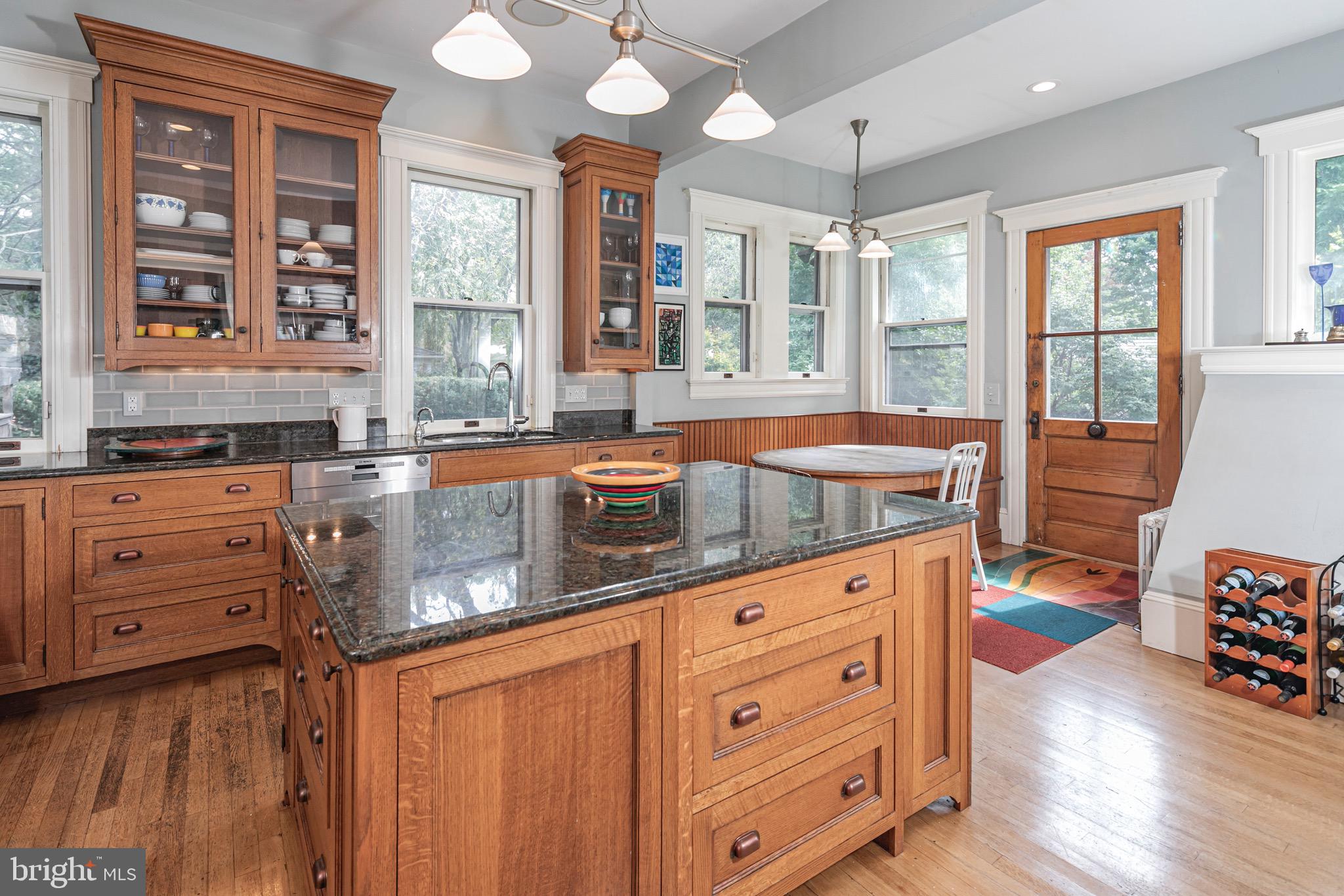 54 Hodge Road Princeton, NJ 08540 - Photo 19 of 51 a kitchen with granite countertop a sink and a stove next to a window