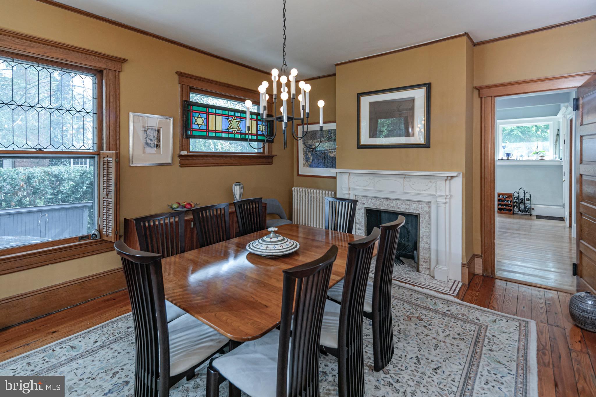 54 Hodge Road Princeton, NJ 08540 - Photo 20 of 51 a dining room with furniture a chandelier and wooden floor