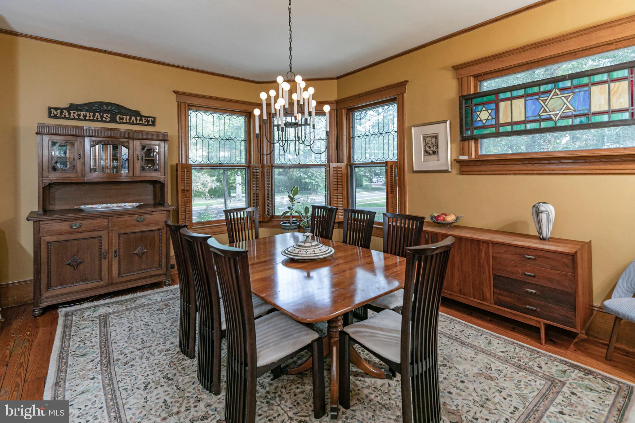 54 Hodge Road Princeton, NJ 08540 - Photo 21 of 51 a dining room with furniture a chandelier and wooden floor