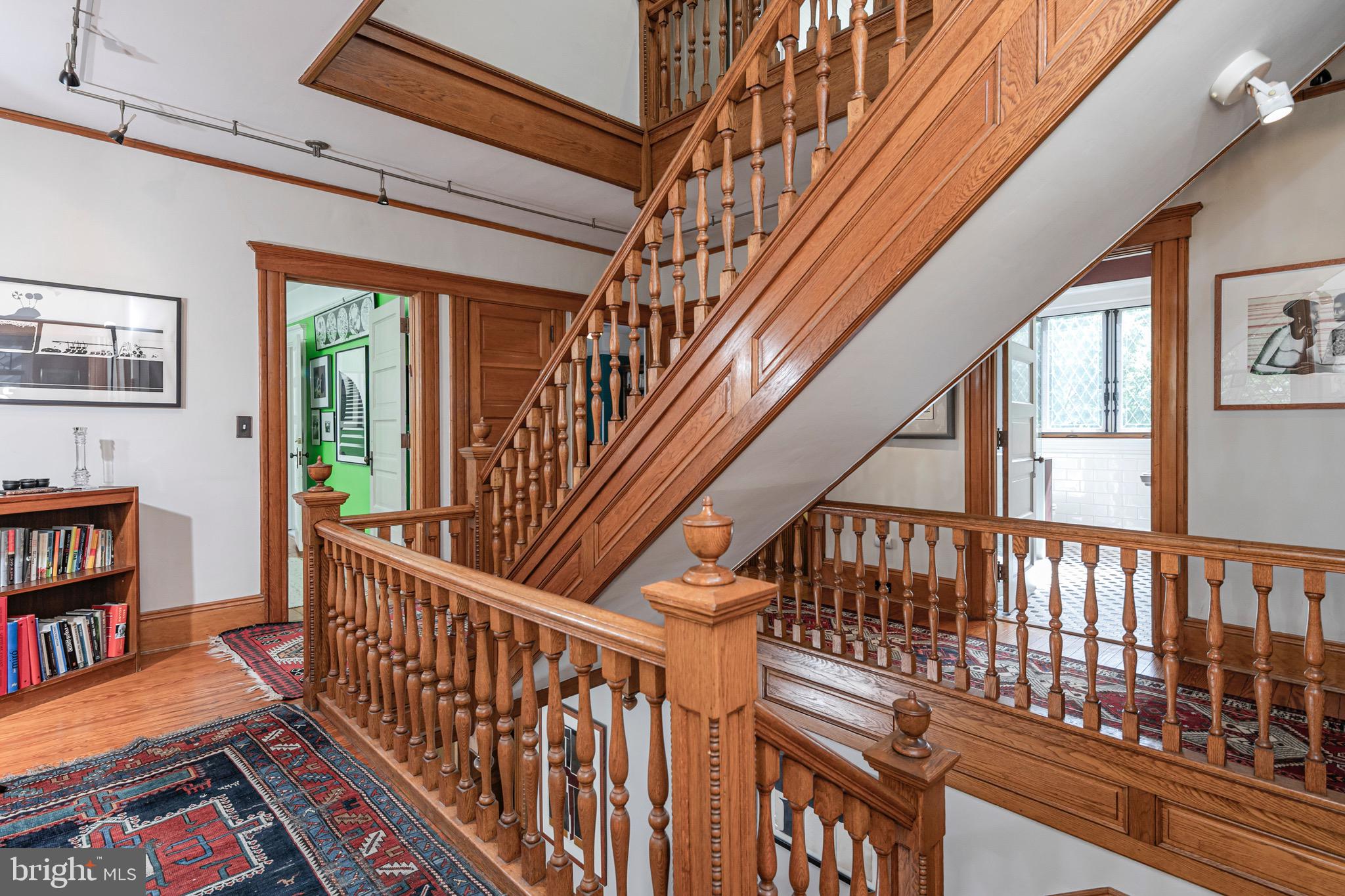 54 Hodge Road Princeton, NJ 08540 - Photo 23 of 51 a view of staircase with lots of frames on wall and a window