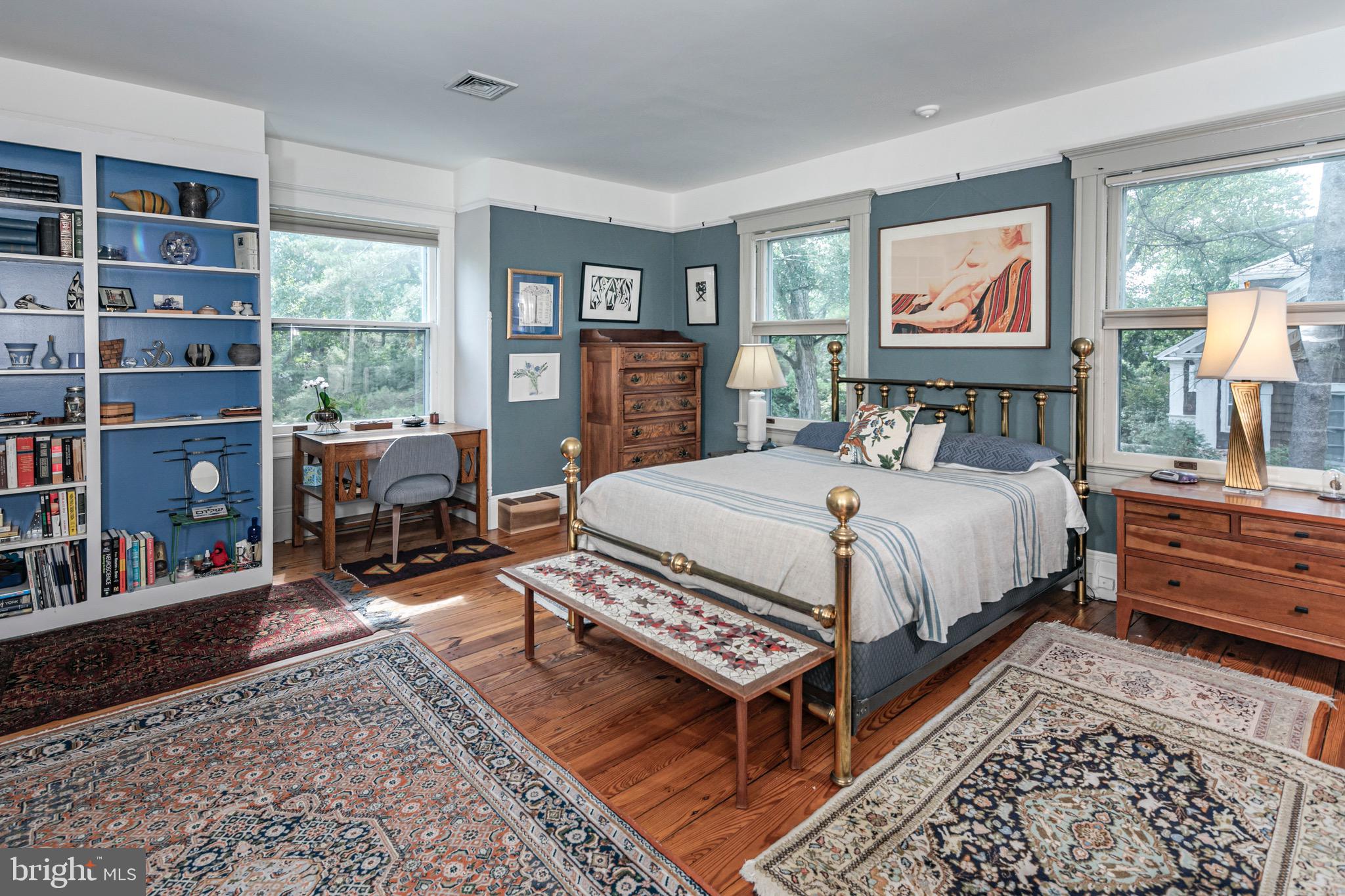 54 Hodge Road Princeton, NJ 08540 - Photo 25 of 51 a bed sitting in a bedroom next to a window with a bookshelf
