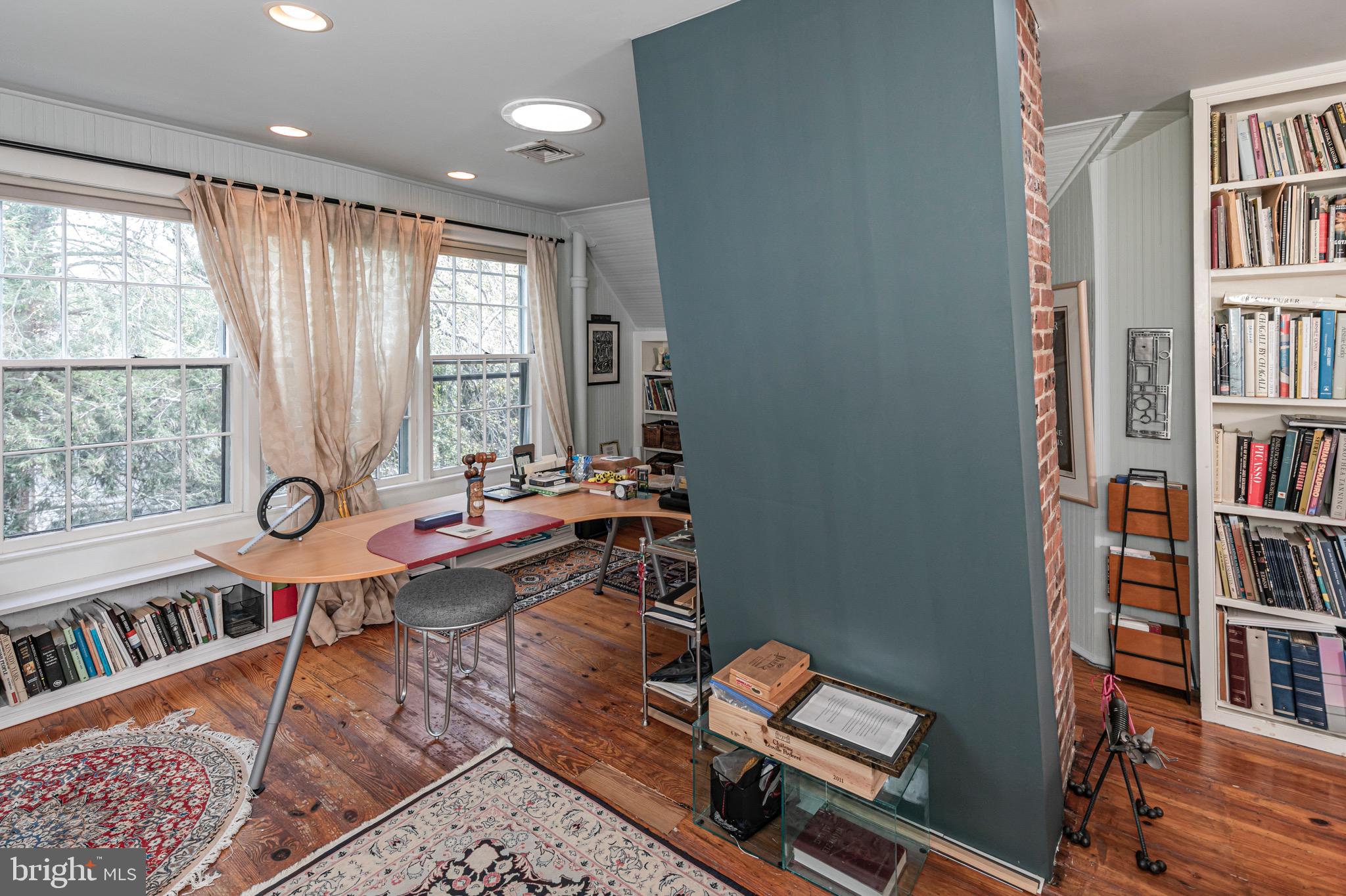 54 Hodge Road Princeton, NJ 08540 - Photo 40 of 51 a living room with furniture a bookshelf and a window