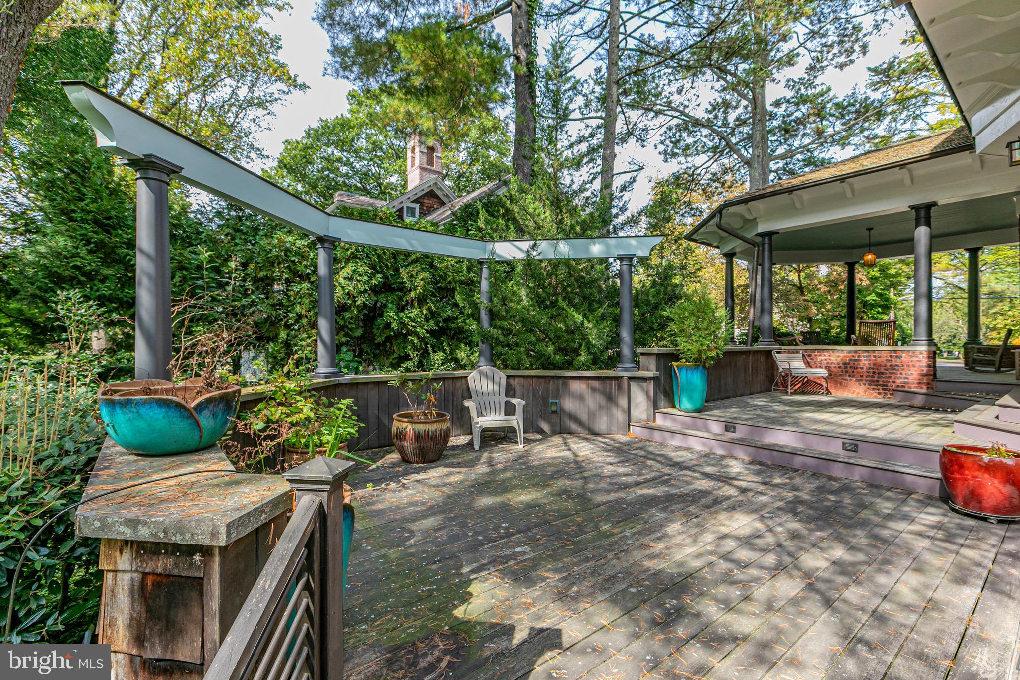 54 Hodge Road Princeton, NJ 08540 - Photo 45 of 51 a view of backyard with a table and chairs under an umbrella