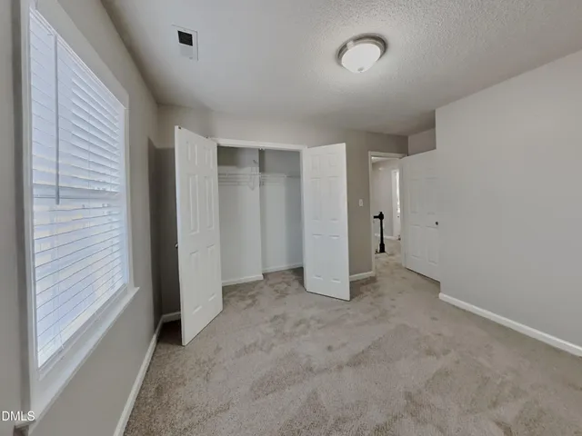 an empty room with a natural light