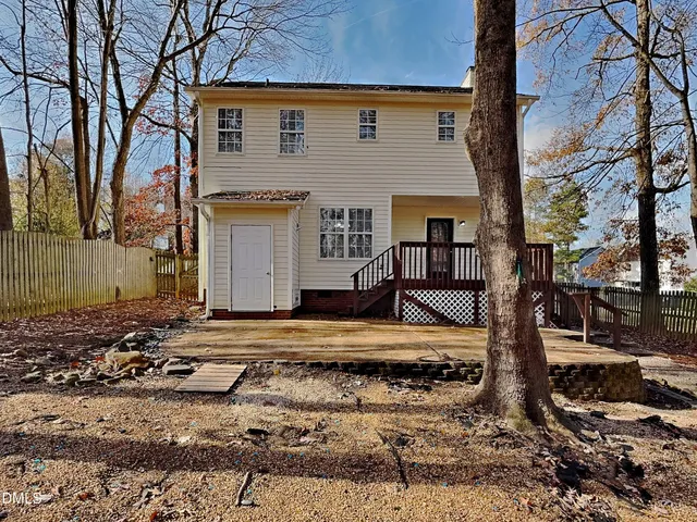 a front view of a house with trees