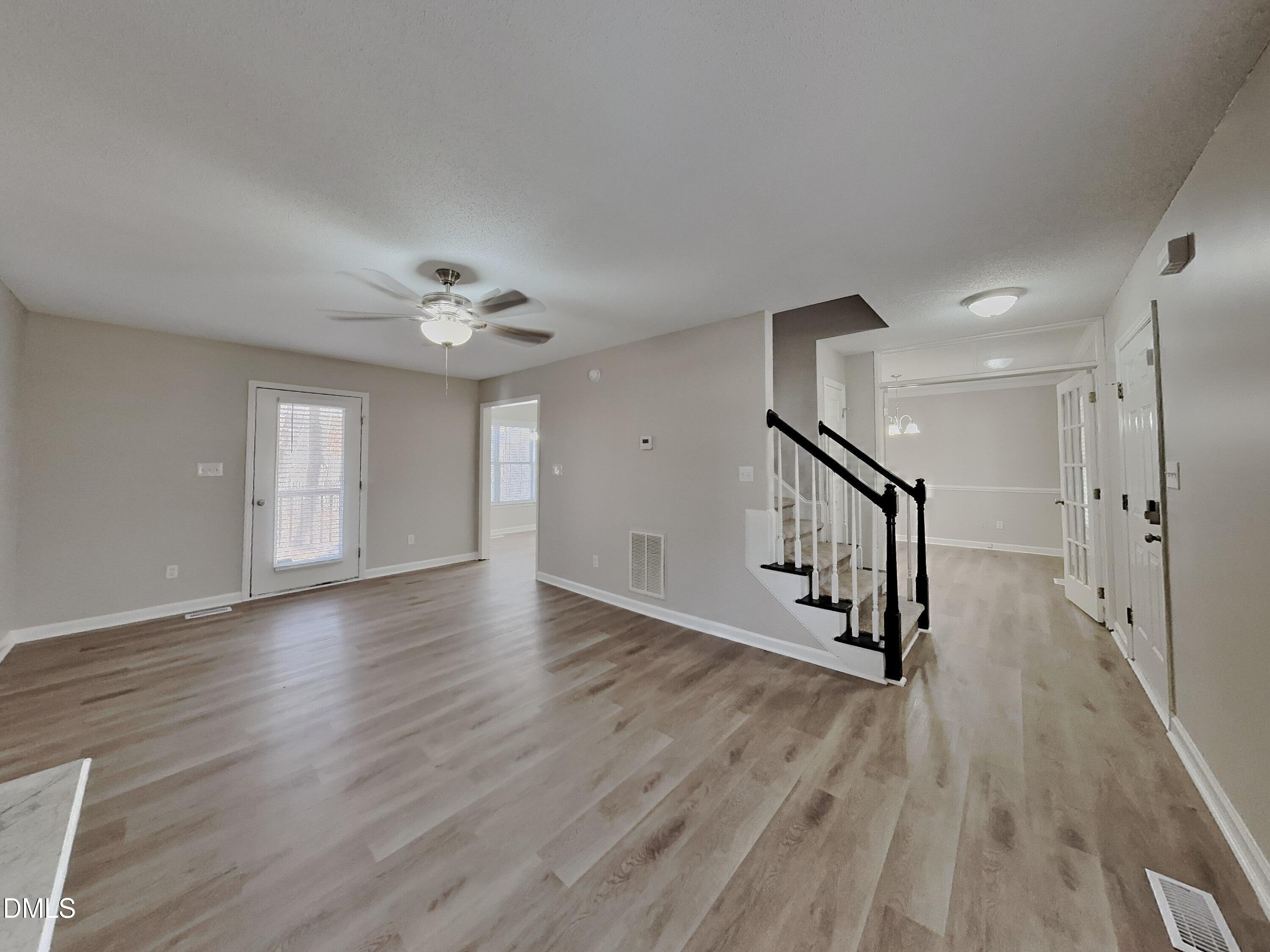 120 Hocutt Drive Clayton, NC 27520 - Photo 2 of 18 a view of a livingroom with wooden floor and a ceiling fan