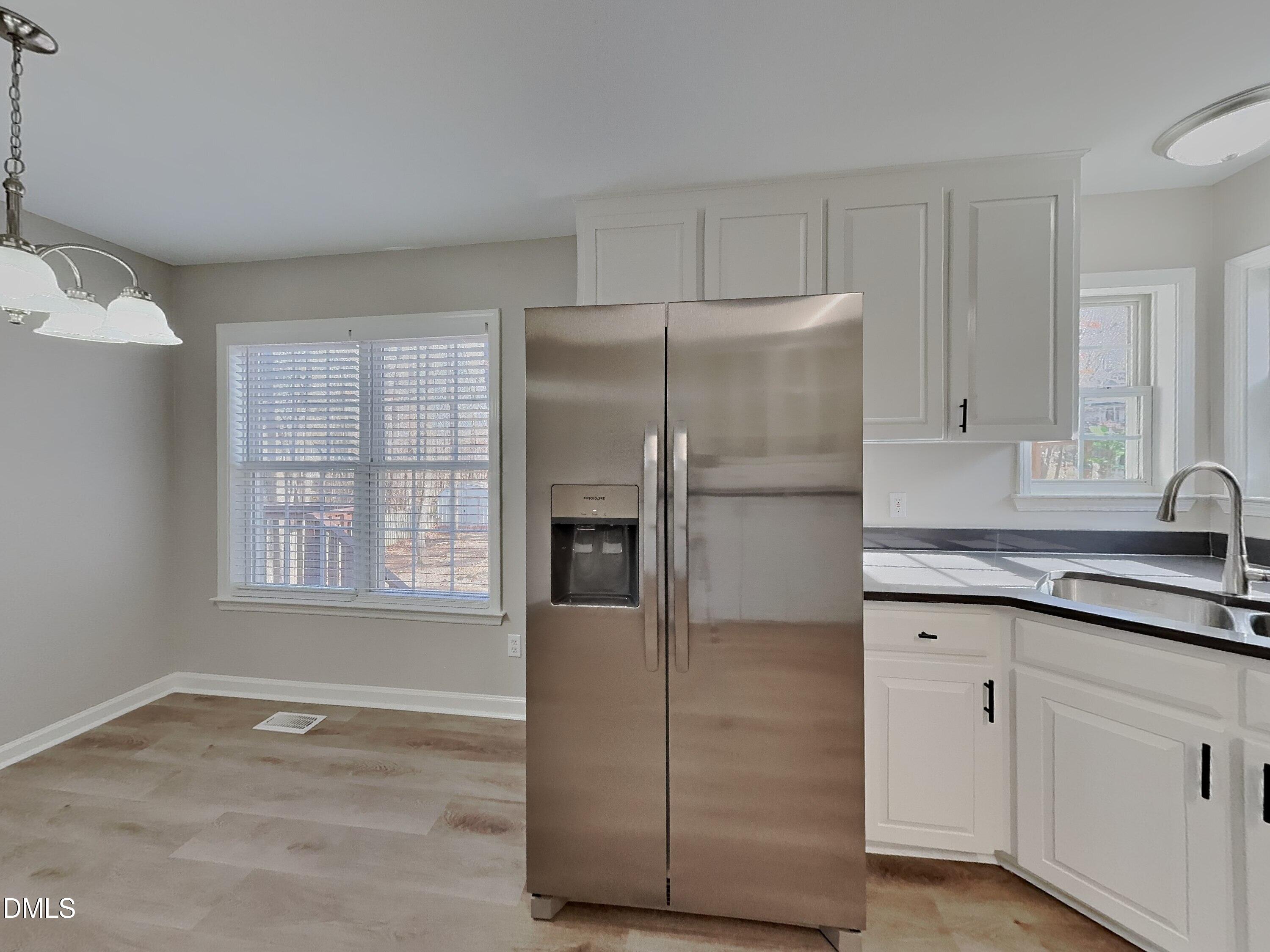 120 Hocutt Drive Clayton, NC 27520 - Photo 6 of 18 a kitchen with stainless steel appliances granite countertop a refrigerator and a stove