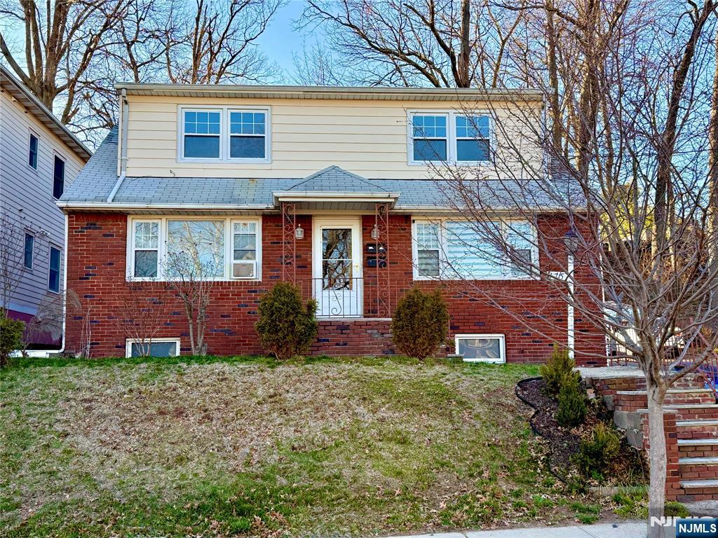 175 Van Winkle Street, Unit 2 East Rutherford, NJ 07073 - Photo 1 of 20 front view of house with a yard