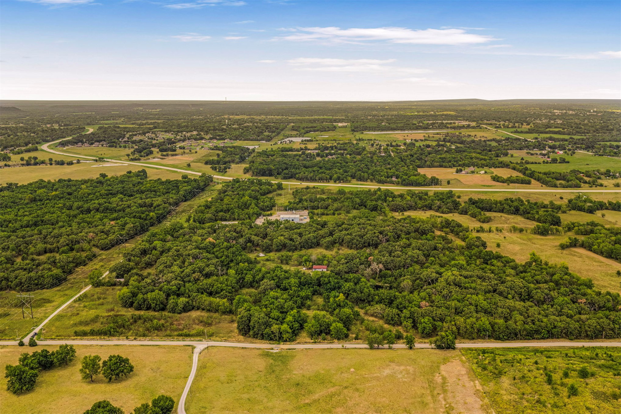 King Road Claremore, OK 74019 - Photo 2 of 45 Expansive land parcel featuring significant tree coverage, open fields, and proximity to highway infrastructure