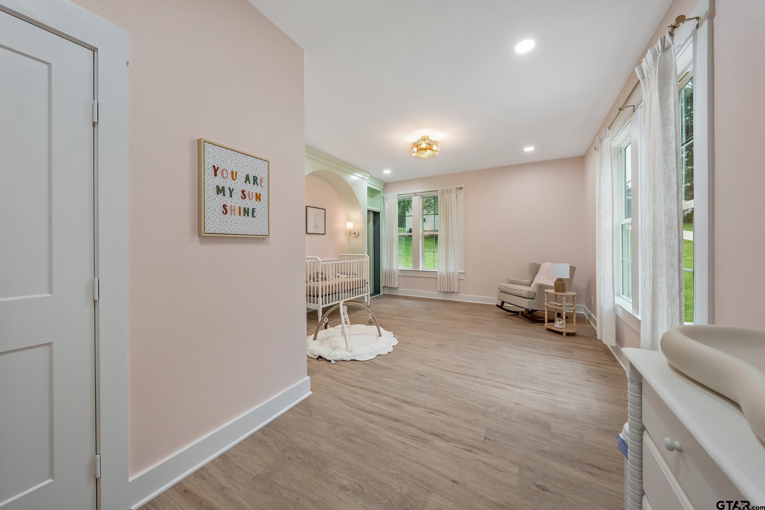 16837 Wilson Road Tyler, TX 75707 - Photo 25 of 44 a living room with furniture and a wooden floor