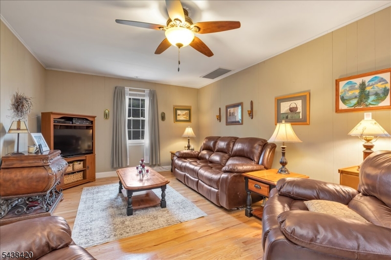 79 Main Street Califon, NJ 07830 - Photo 17 of 50 a living room with furniture ceiling fan and a rug