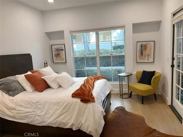 a bedroom with a bed and a couch